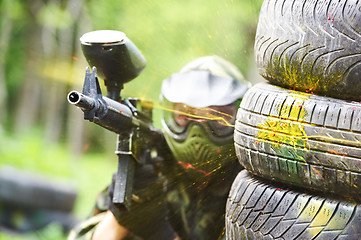 Image showing paintball player under gunfire