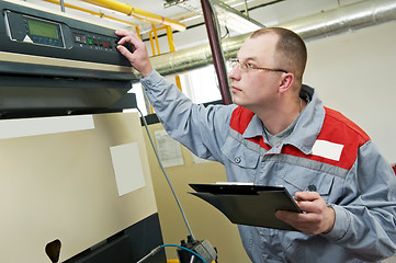 Image showing heating engineer in boiler room