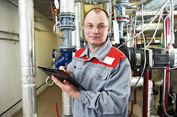 Image showing heating engineer in boiler room