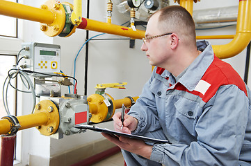 Image showing heating engineer in boiler room