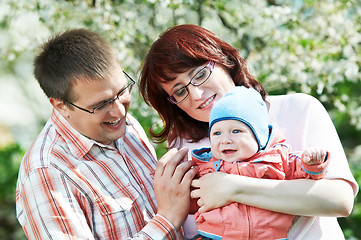 Image showing happy family at spring outdoors