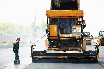 Image showing worker at asphalting works