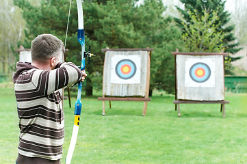 Image showing Archer aiming with bow