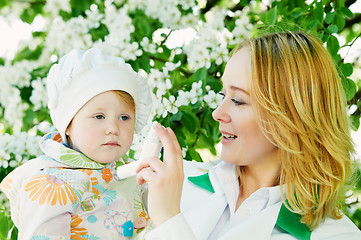 Image showing Baby and doctor with inhaler