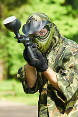 Image showing aiming paintball player