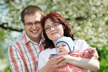 Image showing happy family at spring outdoors