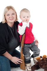 Image showing Little boy playing with gun