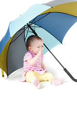 Image showing Cute baby girl under umbrella