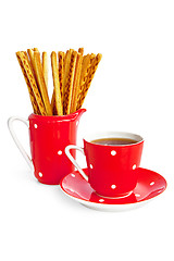 Image showing Bread sticks and coffee in the red utensil