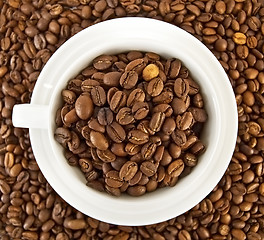 Image showing Coffee beans in the cup against the grain of