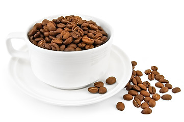 Image showing Coffee grains in a white cup on the table