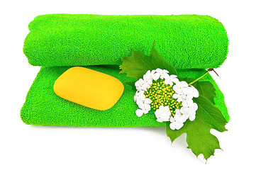 Image showing Green towel with soap and snowball
