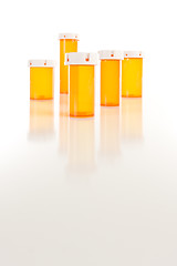 Image showing Empty Medicine Bottles on Reflective Surface