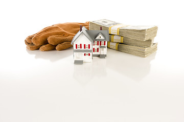 Image showing Stacks of Hundreds with Work Gloves and Small House
