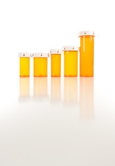 Image showing Empty Medicine Bottles on Reflective Surface
