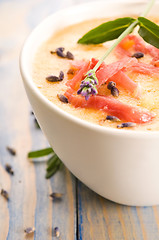 Image showing fresh melon soup with parma ham and lavender flower