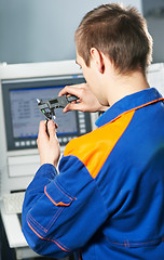 Image showing worker at tool workshop