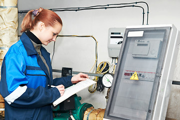 Image showing heating engineer in boiler room