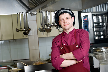 Image showing chef in uniform at kitchen