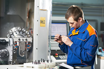 Image showing worker measuring detail