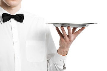 Image showing Waiter hand with metal plate