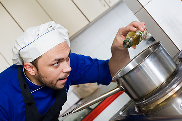 Image showing chef cooking a soup