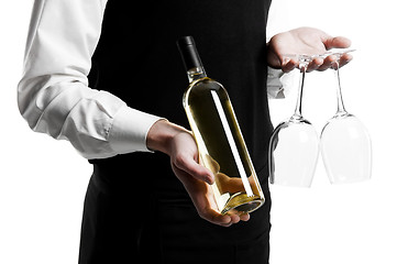 Image showing Waiter sommelier with wine bottle and stemware