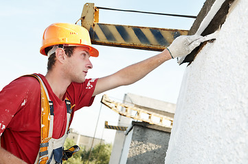 Image showing builder facade painter at work