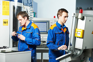 Image showing two workers at tool workshop