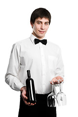 Image showing Waiter sommelier with wine bottle and stemware