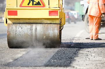 Image showing Asphalt paving works with compactor