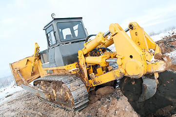 Image showing bulldozer loader at winter frozen soil works