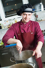 Image showing chef making sauce