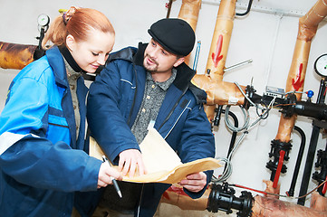 Image showing heating engineers in boiler room