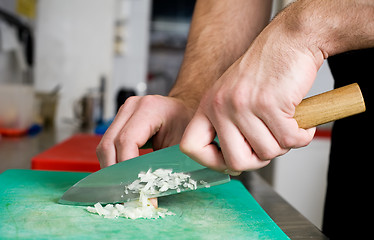 Image showing cutting greens on board