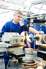Image showing worker at machine tool operating