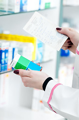 Image showing closeup hand of chemist with drug