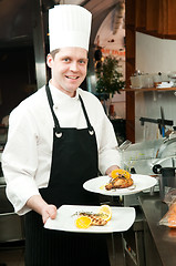 Image showing chef with prepared food on plates