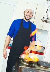 Image showing chef making flambe meat