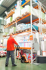 Image showing worker distribution in warehouse with forklift