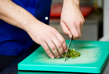 Image showing cutting greens on board