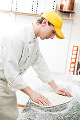 Image showing baker making dough for Pizza