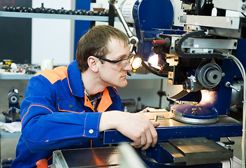 Image showing worker at machine tool operating