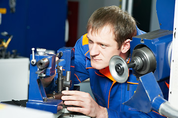 Image showing worker at machine tool operating