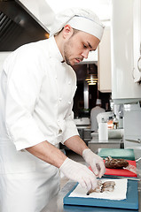 Image showing chef preparing shrimps on board
