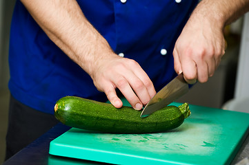 Image showing cutting green marrow on board