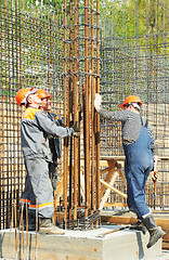 Image showing construction workers making reinforcement