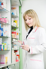 Image showing Pharmacy chemist woman in drugstore