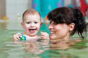 Image showing little girl and mothe in swimming pool