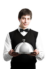 Image showing Happy waiter with cloche lid cover